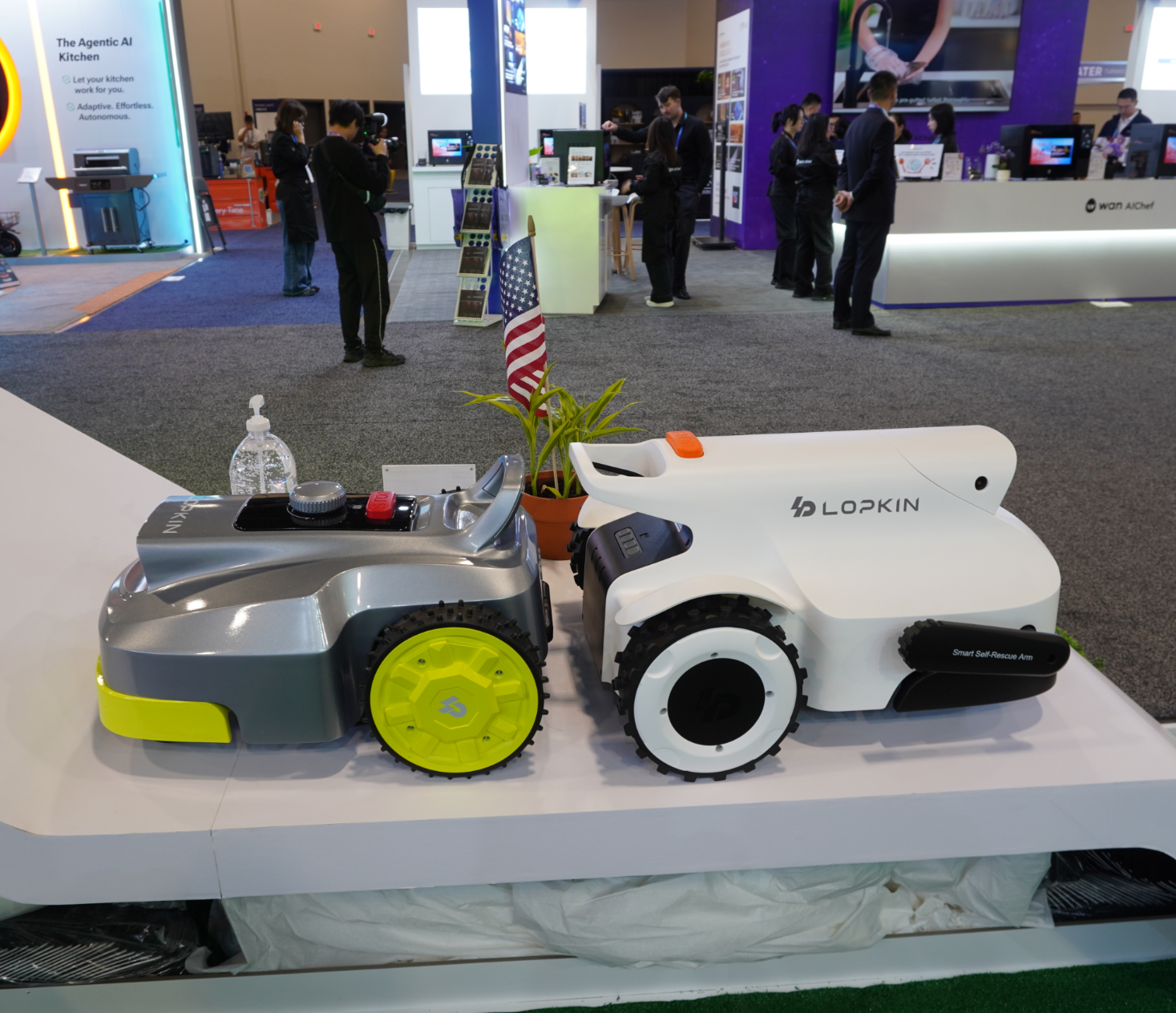 Two LOPKIN robotic lawn mowers presented at an exhibition